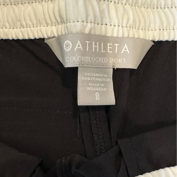 Black Athleta shorts with white stripes and elastic waist - Picture 3 of 3